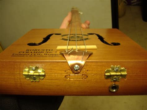 how to make a box electric guitar|guitar made from cigar box.